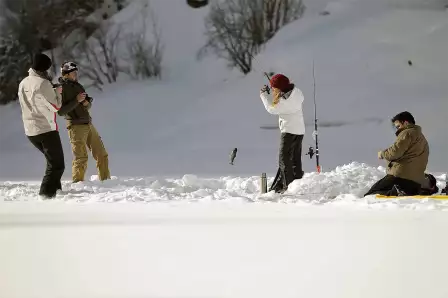 Fishing on a frozen lake